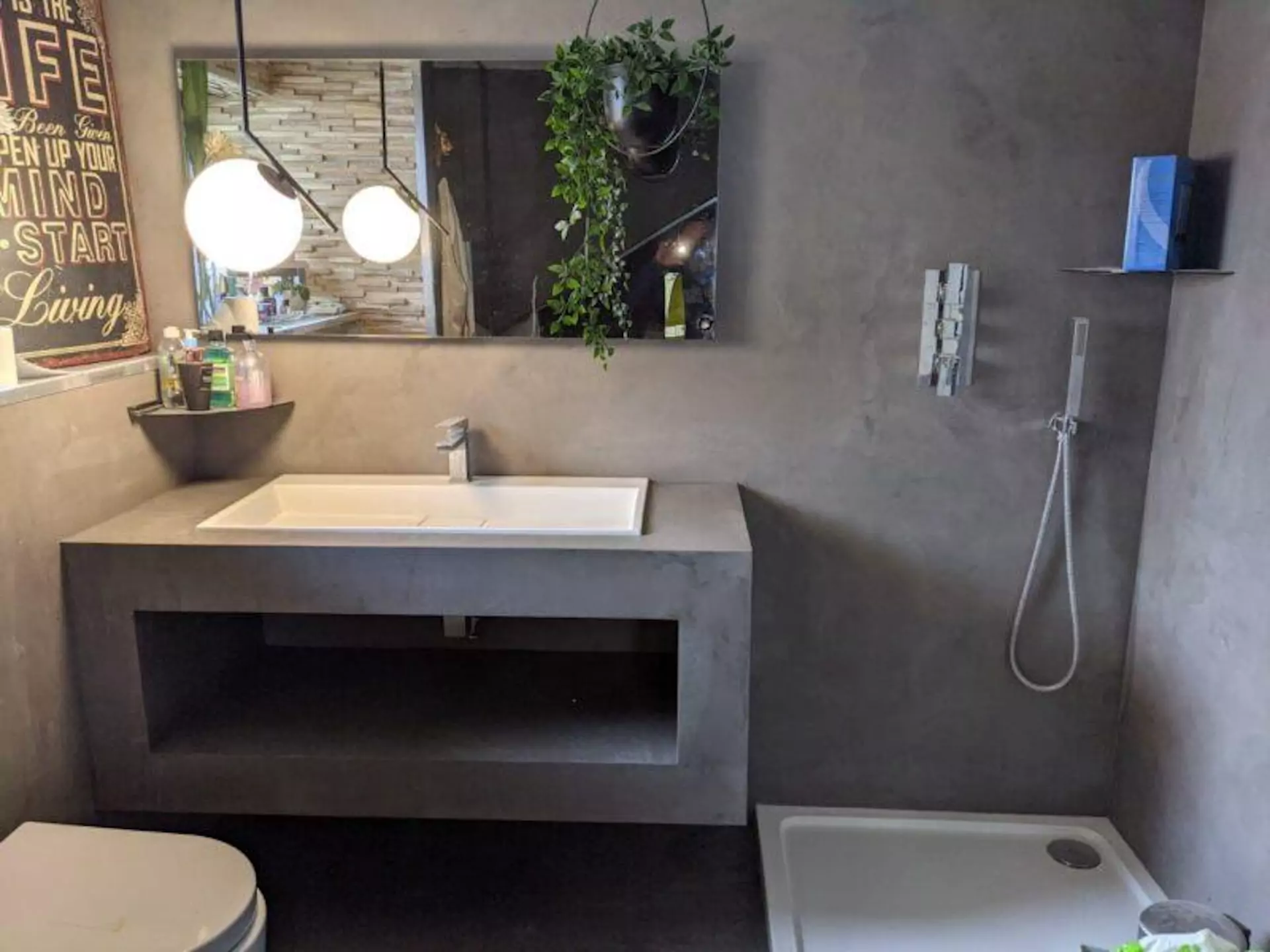 Grey microcement on bathroom floors and walls